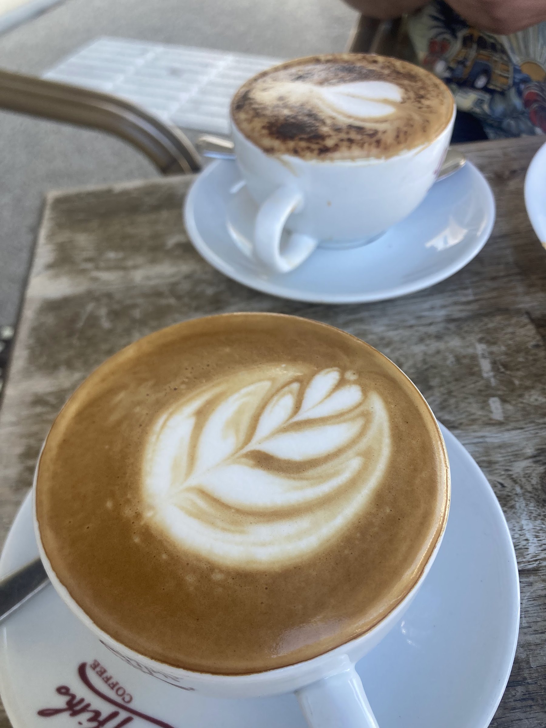 Two coffees with latte art